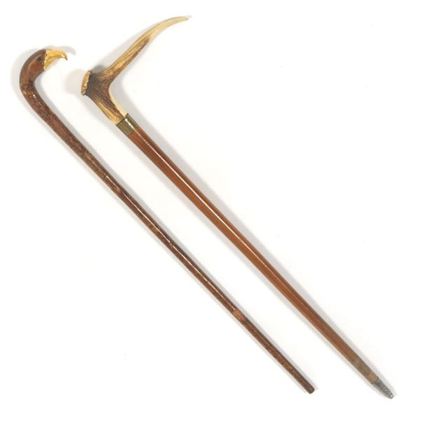 Appraisal: TWO WOODEN CANES One with stag antler handle the other