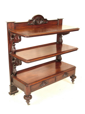 Appraisal: A Victorian mahogany three tier buffet the raised arched back