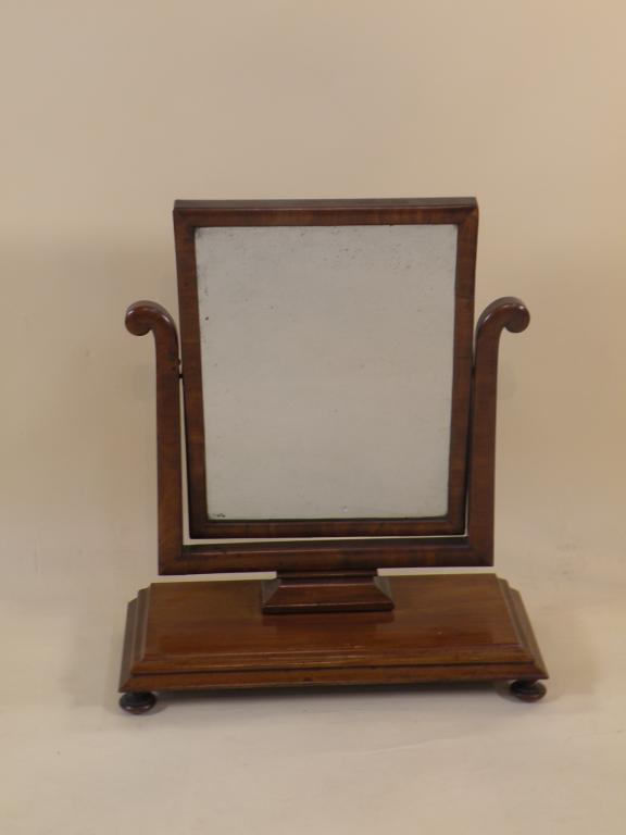 Appraisal: An early Victorian mahogany dressing table mirror the rectangular base