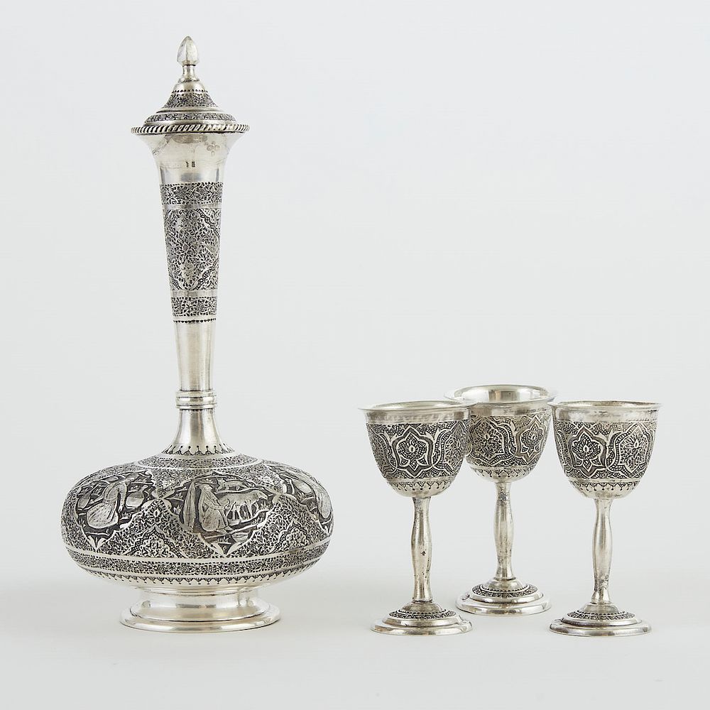 Appraisal: Persian Silver Decanter and Cups Persian Iranian engraved silver decanter