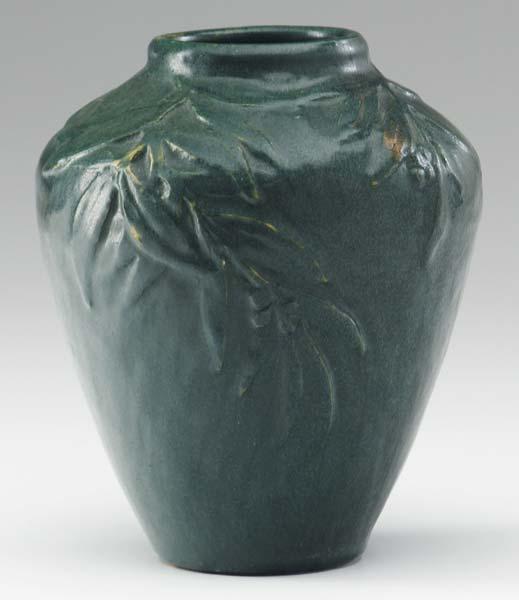 Appraisal: AREQUIPA Vase carved with leaves and berries under a rich