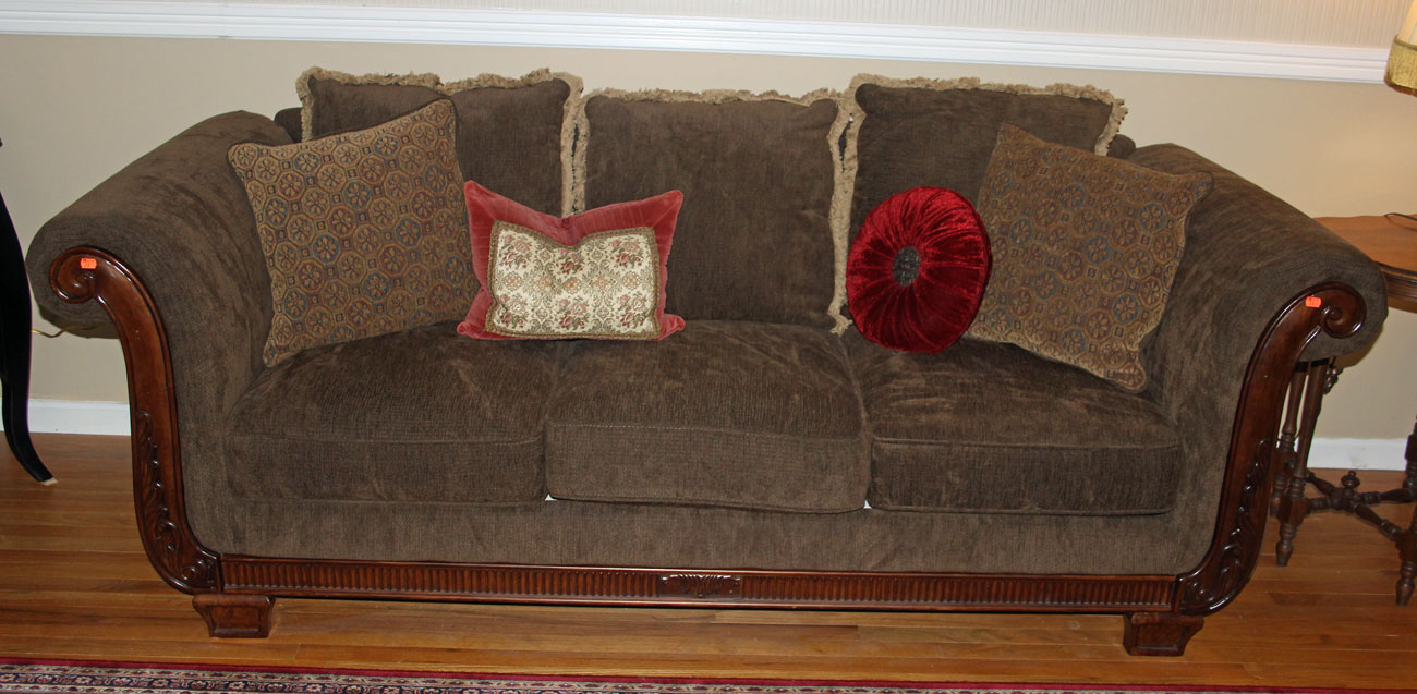 Appraisal: Neoclassical style three-cushion sofa carved wood upholstered