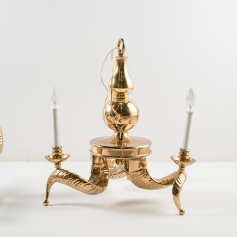 Appraisal: A large brass ram's horn-shaped light fixture with three arms