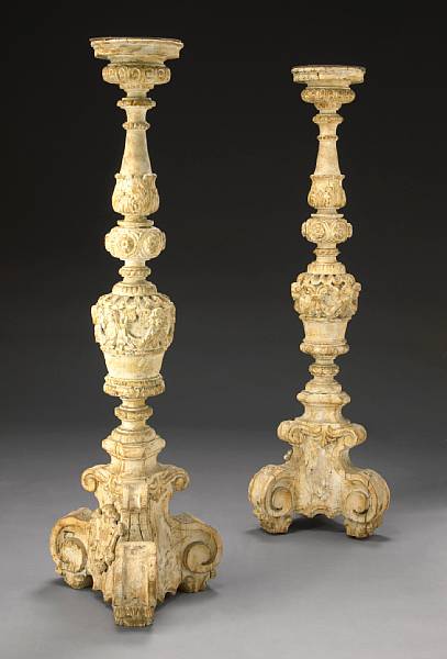 Appraisal: A pair of Italian Baroque paint decorated carved floor torcheres