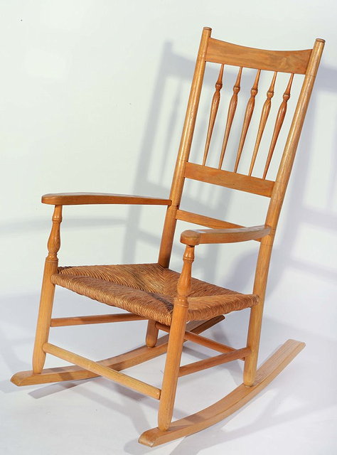 Appraisal: A COTSWOLD STYLE RUSH SEATED ROCKING CHAIR with vertical turned