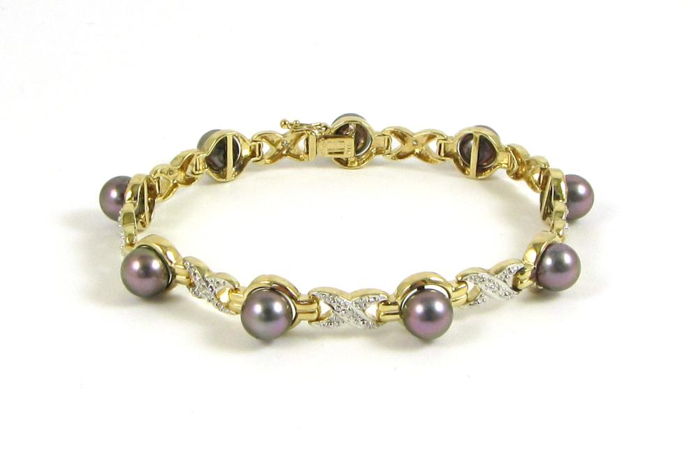 Appraisal: BLACK PEARL AND FOURTEEN KARAT GOLD BRACELET The k yellow