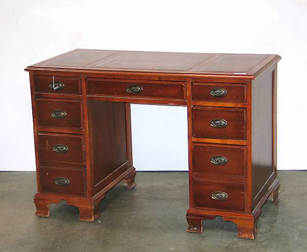 Appraisal: A George III style mahogany pedestal desk with gold embossed