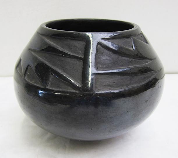 Appraisal: BLACKWARE POTTERY VESSEL having tapering neck and is adorned with