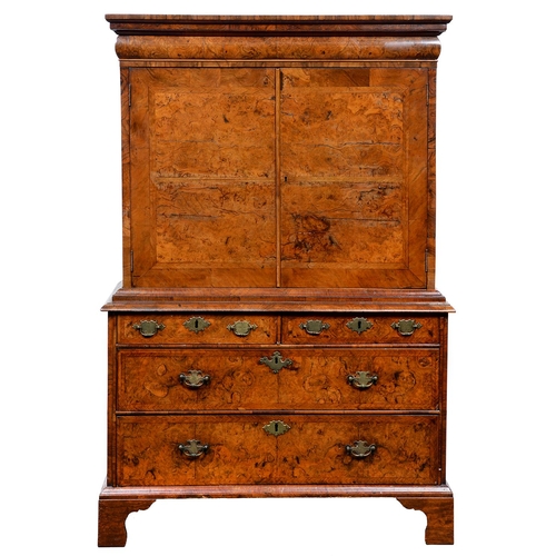 Appraisal: A Queen Anne walnut and feather banded cabinet on chest