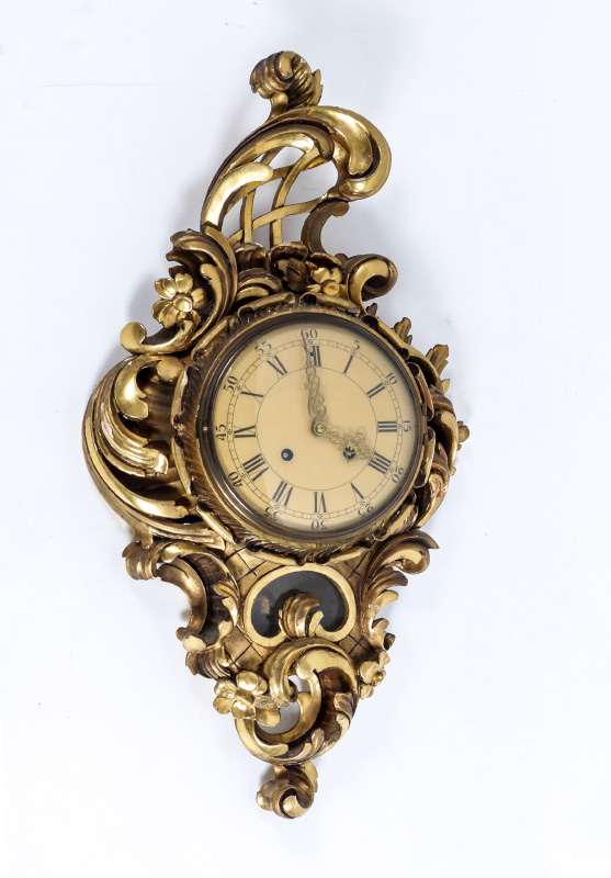 Appraisal: CARVED AND GILDED SWEDISH CARTEL CLOCK Carved wood rococo style