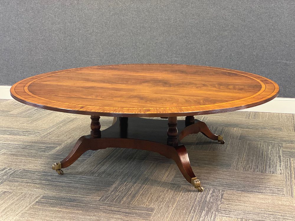 Appraisal: A MONUMENTAL REGENCY STYLE MAHOGANY DINING TABLE A MONUMENTAL REGENCY