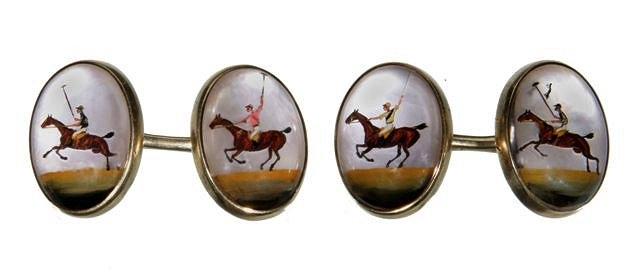 Appraisal: A PAIR OF OVAL CUFFLINKS with reverse painted polo players