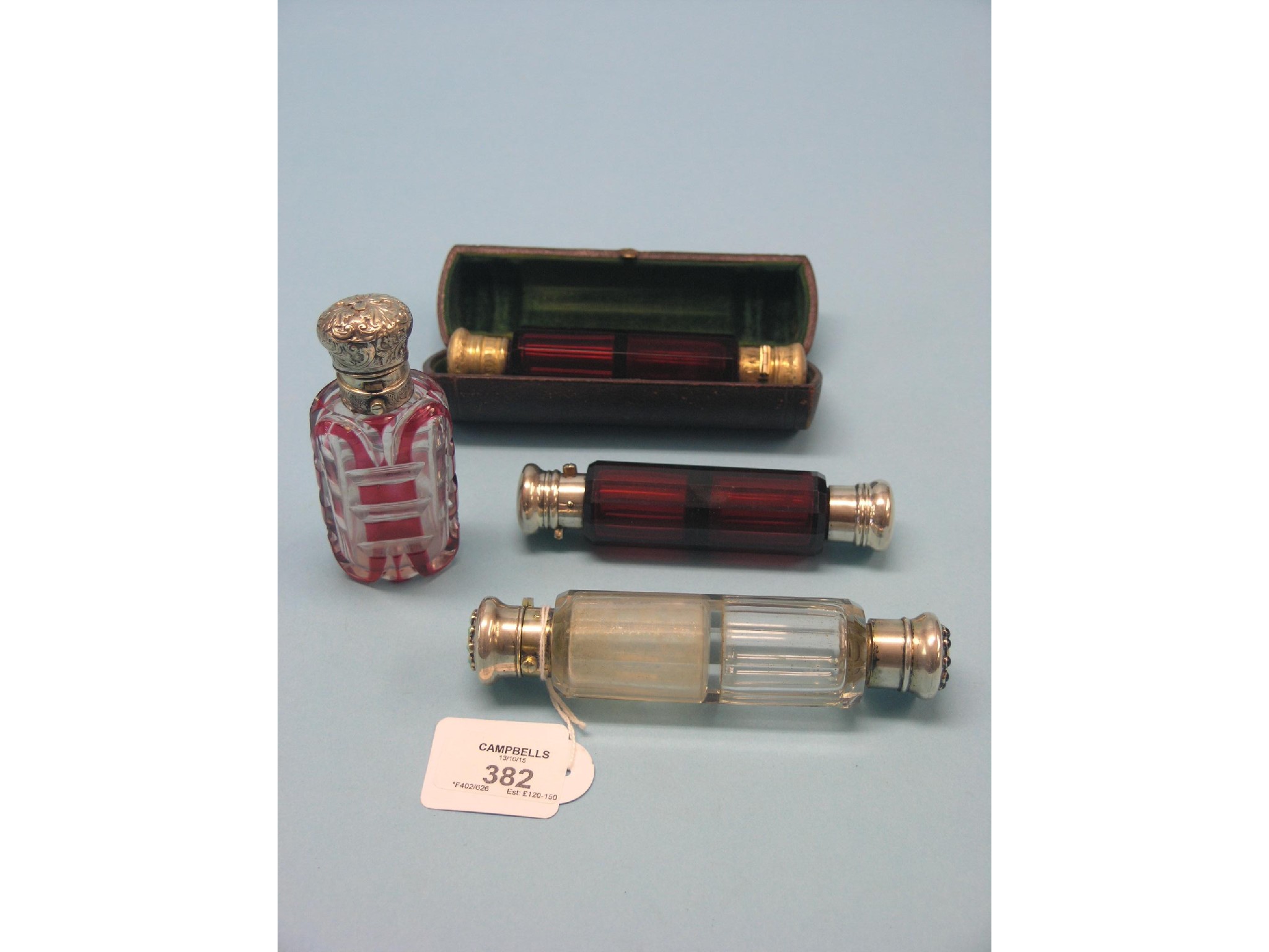 Appraisal: A Victorian ruby glass double-ended scent bottle with gilt-metal mounts