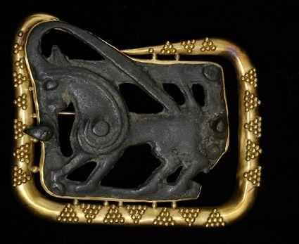 Appraisal: Bronze Brooch with Animal Relief Set in Gold