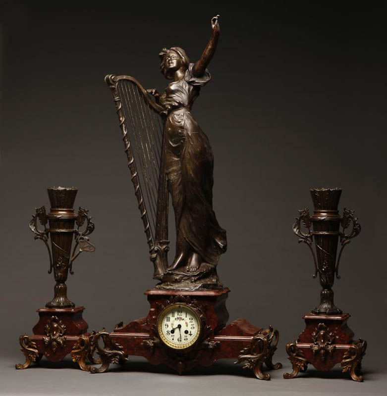 Appraisal: A French spelter Rouge Griotte clock garniture A French spelter