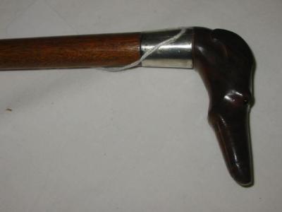 Appraisal: A VICTORIAN WALKING STICK the lignum vitae grip carved as