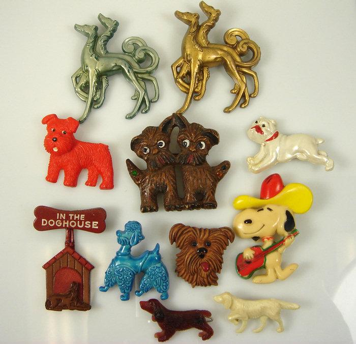 Appraisal: costume jewelry dog pins plastic including Snoopy playing guitar c