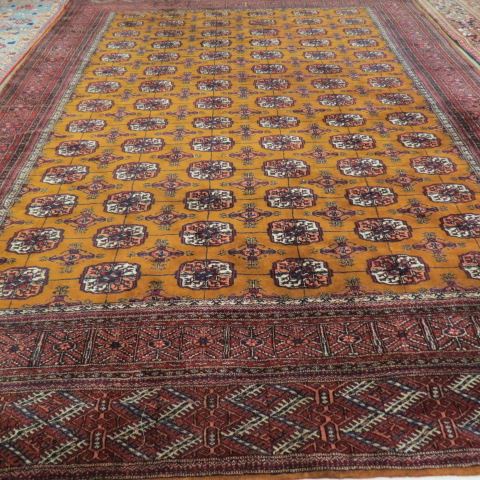 Appraisal: Bokara Handmade Room Size Rug elaborate designs tight weave tan