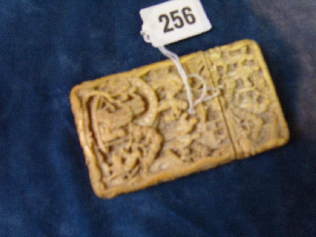 Appraisal: An eastern carved ivory card case with relief pastoral scene