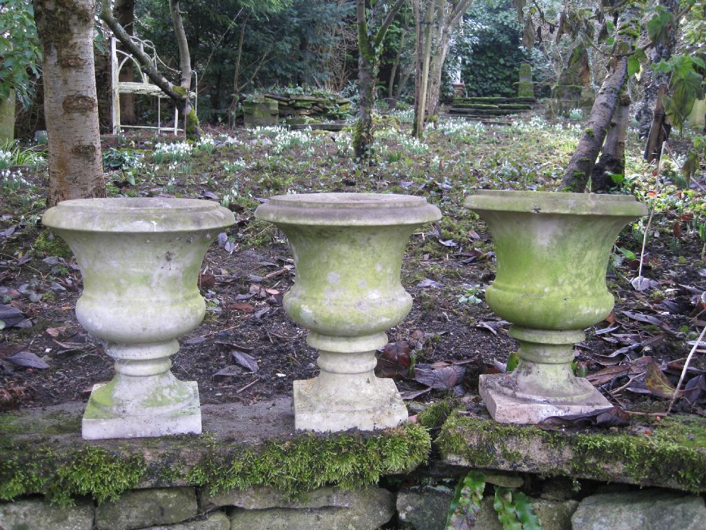 Appraisal: A near pair of small Garden Urns and another similar