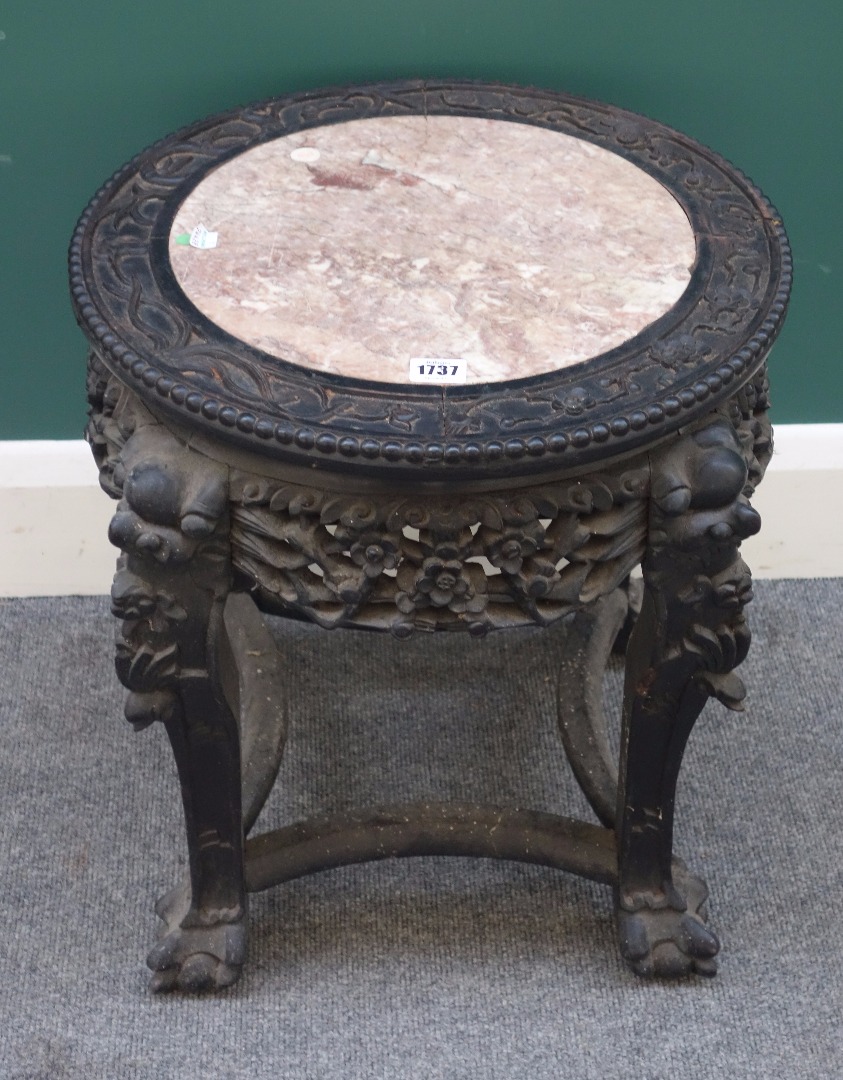 Appraisal: A late th century Chinese urn stand with marble inset