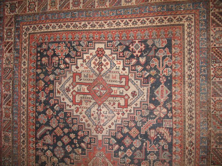 Appraisal: A NORTH WEST PERSIAN TRIBAL RUG the blue central panel