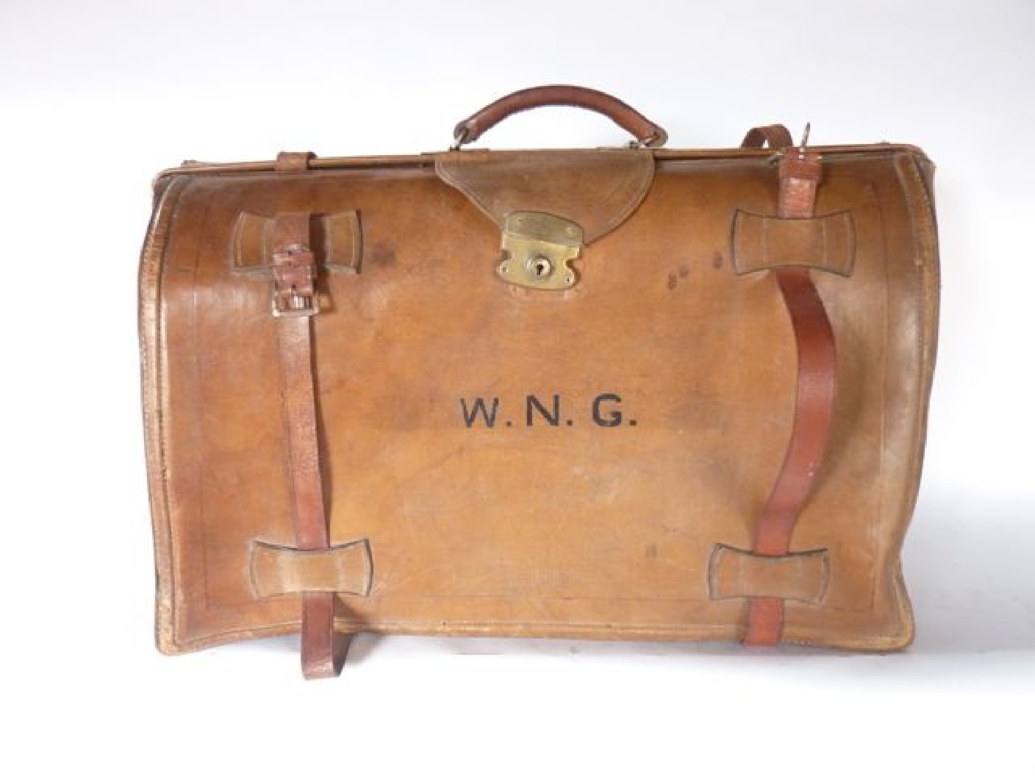 Appraisal: A large vintage stitched tan leather luggage case revealing a