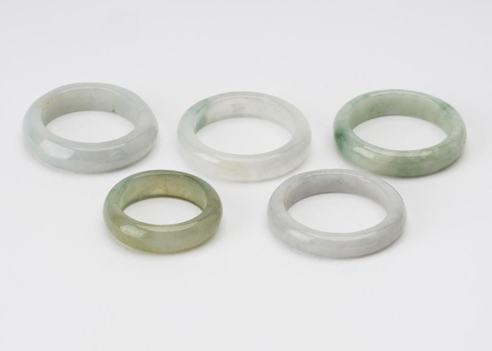 Appraisal: FIVE ASSORTED JADE RINGSof various colors and sizes sizes Condition