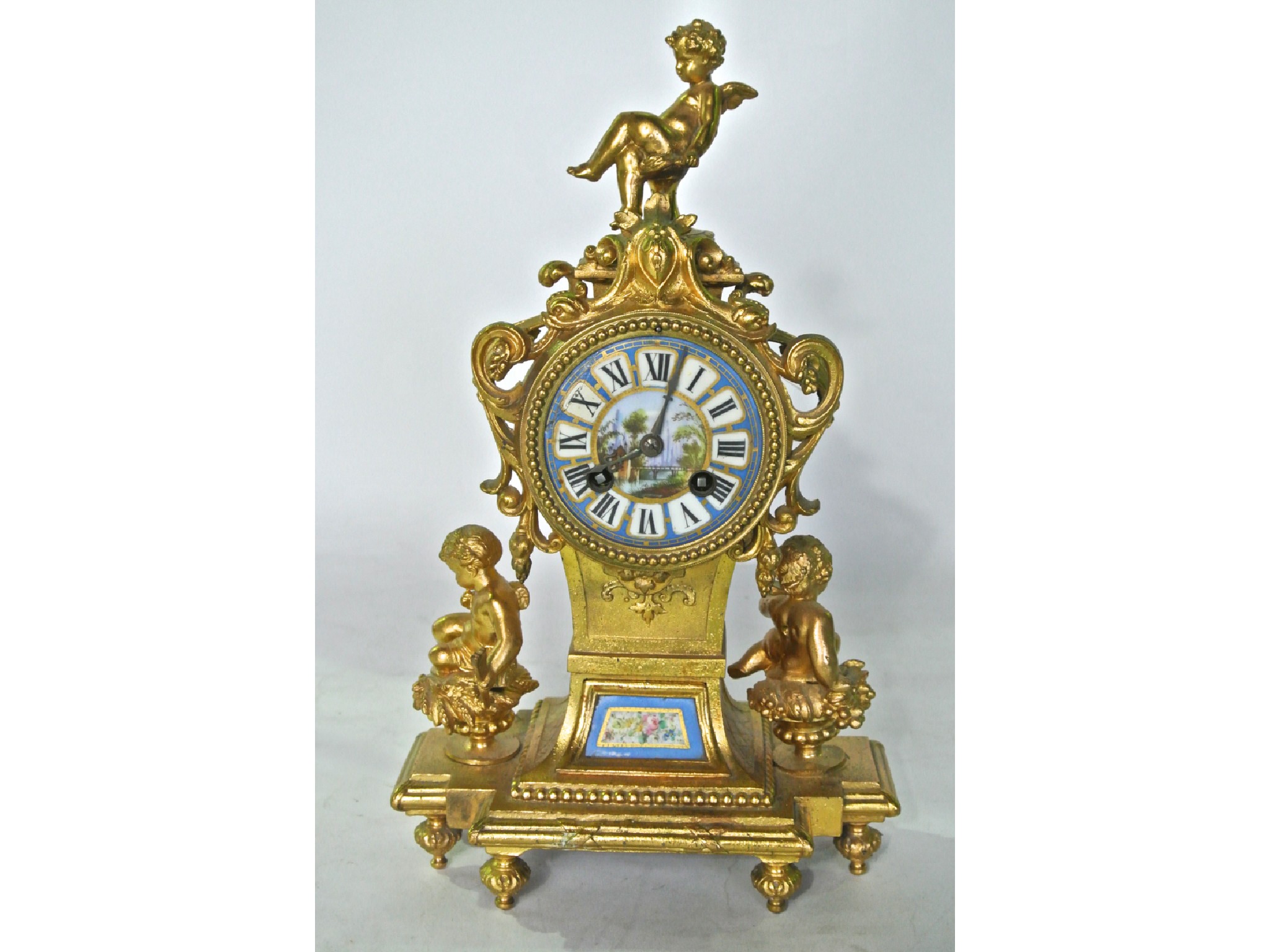 Appraisal: A th century gilded mantle clock with hand painted porcelain