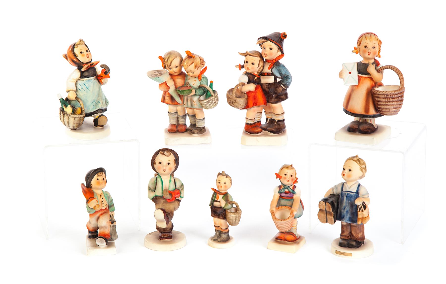 Appraisal: NINE HUMMEL FIGURINES Germany nd half- th century Boots girl