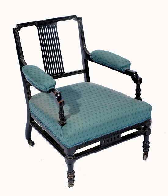 Appraisal: A late Victorian ebonised Aesthetic style salon armchair stamped 'C