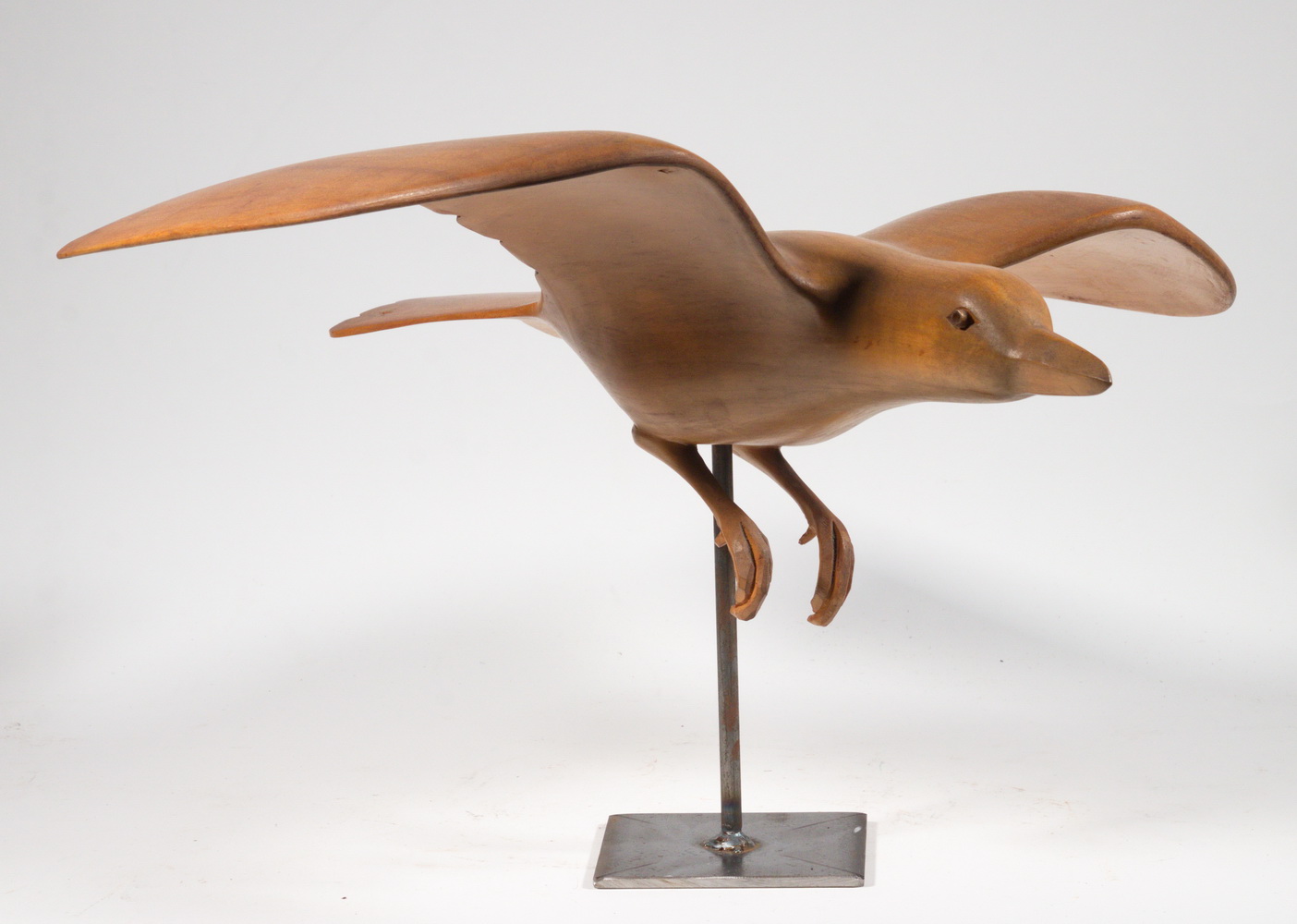 Appraisal: CARVED WOOD BIRD SCULPTURE Seagull in Flight rendered in teak