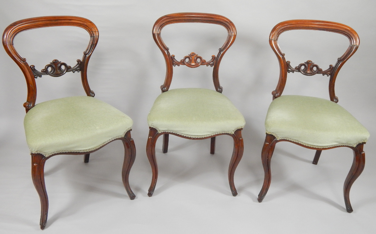 Appraisal: Three Victorian rosewood balloon back dining chairs with green overstuffed