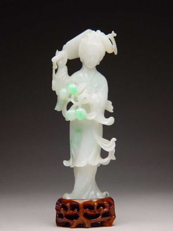 Appraisal: CARVED JADEITE BEAUTY Well carved Chinese jadeite of icy green