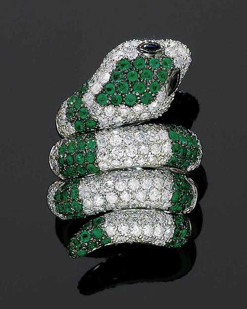 Appraisal: EMERALD DIAMOND AND SAPPHIRE RING White gold Very decorative modern