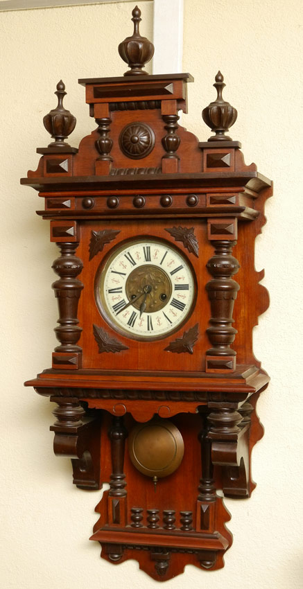 Appraisal: GERMAN CARVED WALL CLOCK Removable architectural crest with finials Case