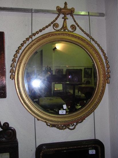 Appraisal: AN TH CENTURY ADAM STYLE CIRCULAR WALL MIRROR with urn