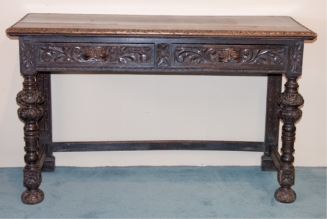 Appraisal: Two heavily carved drawers with ornate turned legs H x