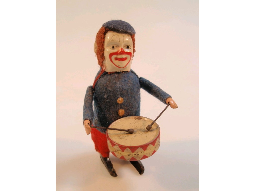 Appraisal: A Schuco clockwork drumming clown figure cm high