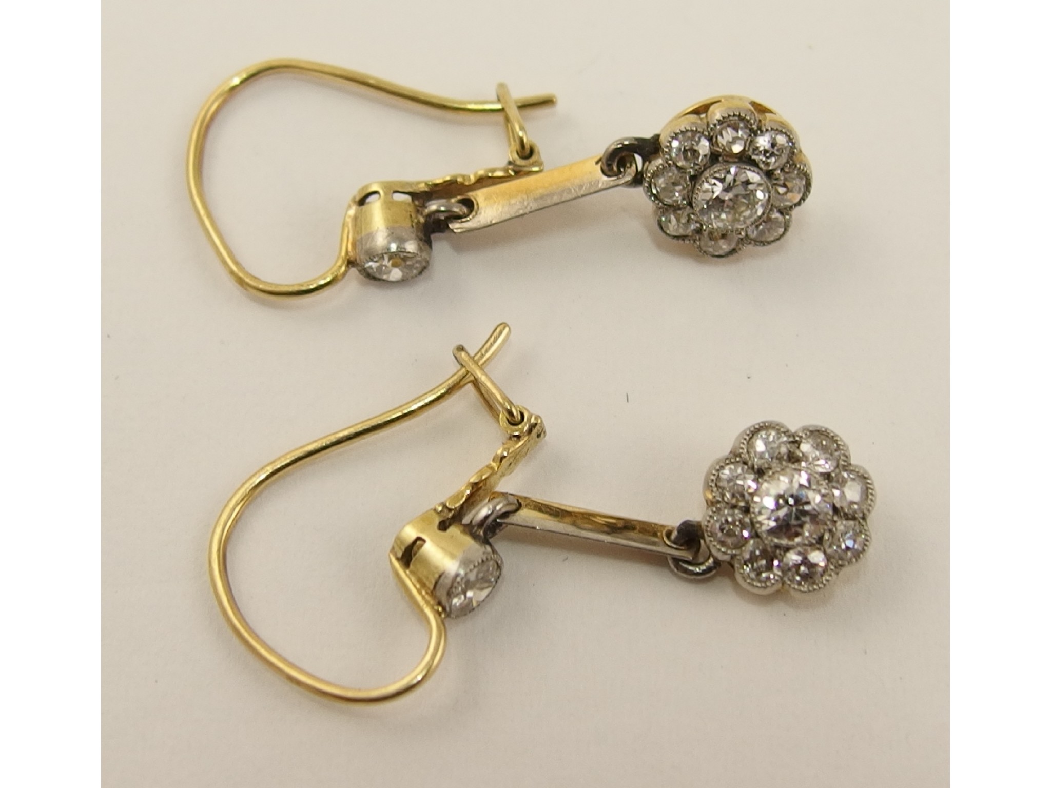 Appraisal: A pair of Edwardian old cut diamond flower earringsthe millgrained