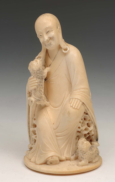 Appraisal: A Chinese ivory carving of a LohanRepublican periodseated upon a