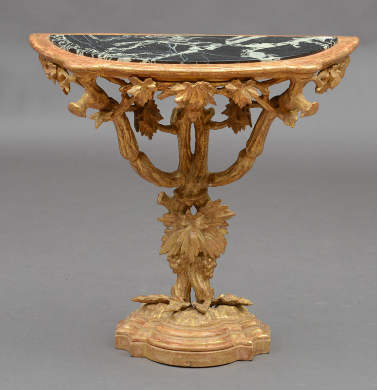 Appraisal: ITALIAN ROCOCO GILTWOOD CONSOLE TABLE The D-shaped top with eared