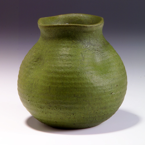 Appraisal: MERRIMAC Ridged and dimpled bulbous vase covered in matte green