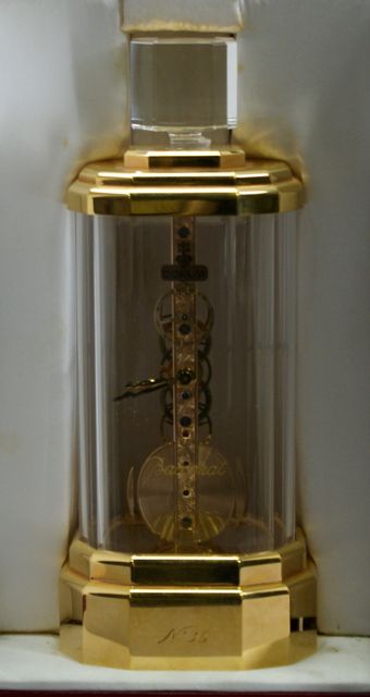 Appraisal: A Corum Baccarat mantle clock in the form of a