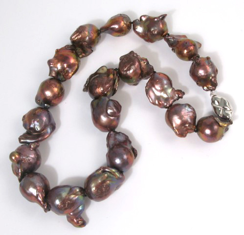 Appraisal: BAROQUE PEARL AND SILVER NECKLACE strung with well matched baroque