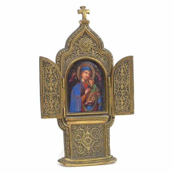 Appraisal: A Russian gilt metal and porcelain traveling icon of the