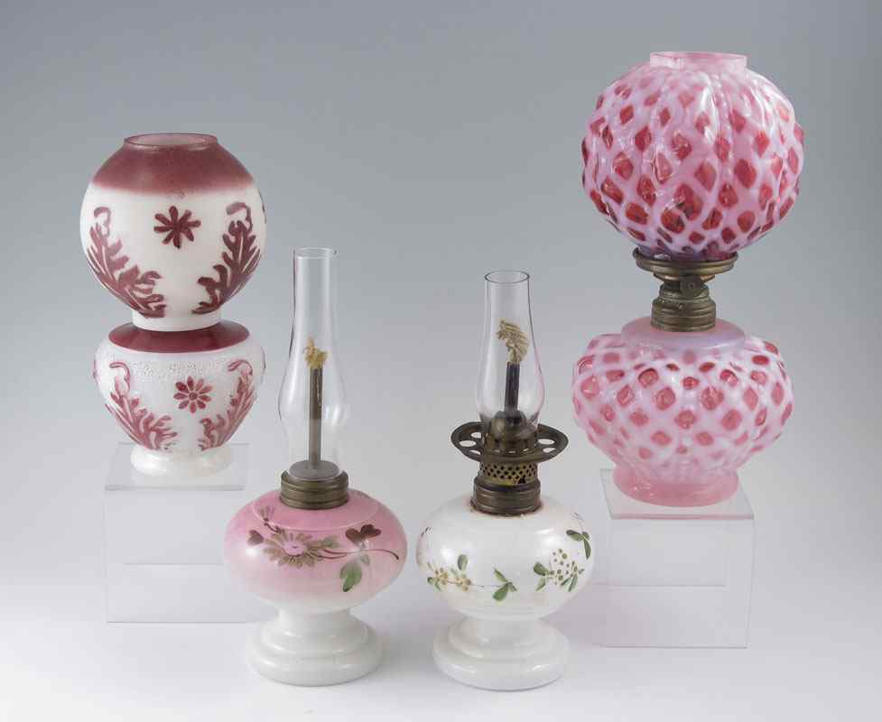 Appraisal: GROUP OF MINIATURE OIL LAMPS One cranberry opalescent chip on