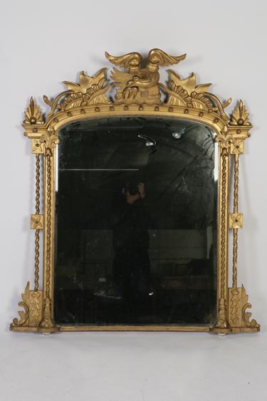 Appraisal: A LARGE VICTORIAN GILT FRAMED OVERMANTEL MIRROR the arch topped