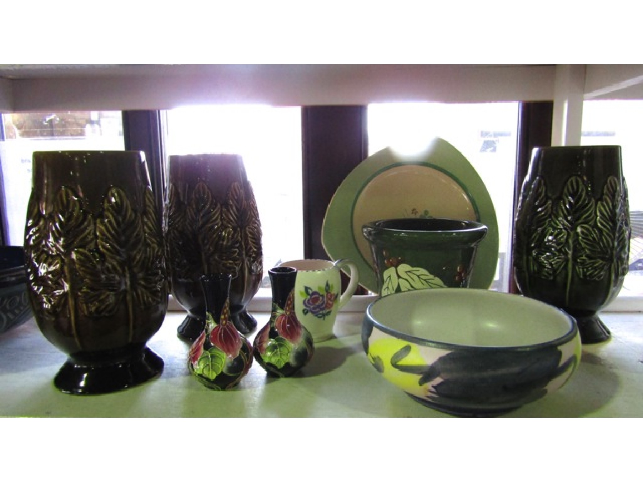 Appraisal: Three Sylvac vases with leaf moulded decoration and impressed numbers