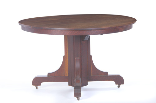 Appraisal: GUSTAV STICKLEY Split pedestal dining table with a bracketed base